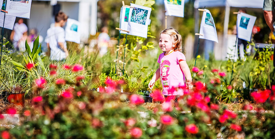 Child in Garden of South Carolina Neighborhood of Summers Corner